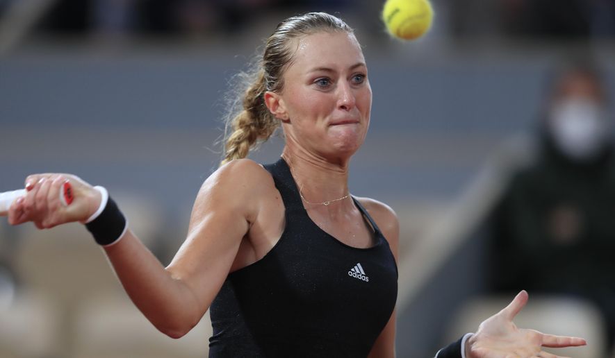 France's Kristina Mladenovic plays a shot against Germany's Laura Siegemund in the first round match of the French Open tennis tournament at the Roland Garros stadium in Paris, France, Tuesday, Sept. 29, 2020. (AP Photo/Michel Euler)