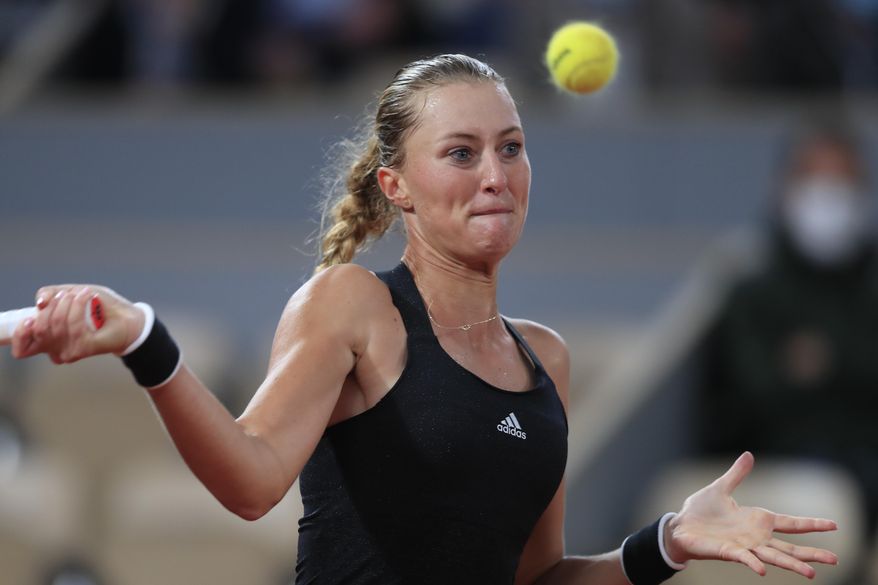 France's Kristina Mladenovic plays a shot against Germany's Laura Siegemund in the first round match of the French Open tennis tournament at the Roland Garros stadium in Paris, France, Tuesday, Sept. 29, 2020. (AP Photo/Michel Euler)