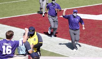 Kansas State head coach Chris Klieman pumps his fist while running off the field after his team&#39;s 38-35 win over the Oklahoma in an NCAA college football game, Saturday, Sept. 26, 2020, in Norman, Okla. (Ian Maule/Tulsa World via AP)