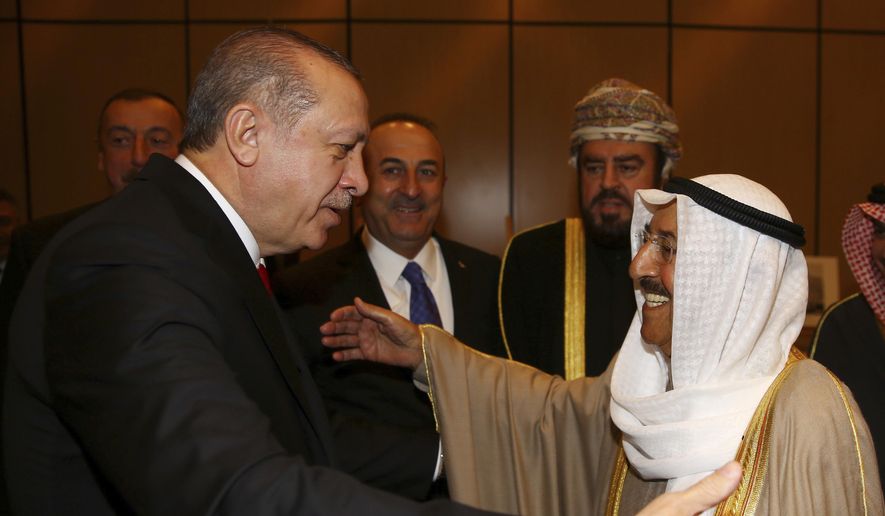 In this Wednesday, Dec. 13, 2017, file photo, Turkey&#39;s President Recep Tayyip Erdogan, left, welcomes Kuwait&#39;s Emir Sheikh Sabah Al Ahmad Al Sabah, prior to the opening session of the Organisation of Islamic Cooperation Extraordinary Summit in Istanbul. Kuwait state television said Tuesday, Sept. 29, 2020, the country&#39;s 91-year-old ruler, Sheikh Sabah Al Ahmad Al Sabah, had died. (Kayhan Ozer/Pool Photo via AP, File)