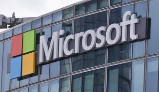 FILE - This April 12, 2016 file photo shows the Microsoft logo in Issy-les-Moulineaux, outside Paris, France. Microsoft took five hours to resolve a major outage of its workplace applications on Monday, but has not clarified what caused the outage. The company said the outage, which affected users’ ability to log into Office 365 applications, began early evening Monday Eastern time. Microsoft did not reply to questions Tuesday, Sept. 29, 2020 about what caused the outage, but said on its service-status Twitter account that it had identified a “recent change” that caused problems. (AP Photo/Michel Euler, File)