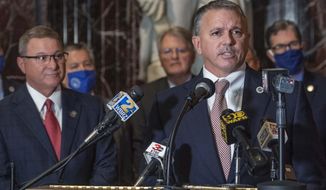 House Speaker Clay Schexnayder, R-Gonzales, at lectern, and Senate President Page Cortez, R-Lafayette, left, answer questions at a news conference in Memorial Hall before the start of the Special Legislative Session, Monday, Sept. 28, 2020, in Baton Rouge, La. (Bill Feig/The Advocate via AP)