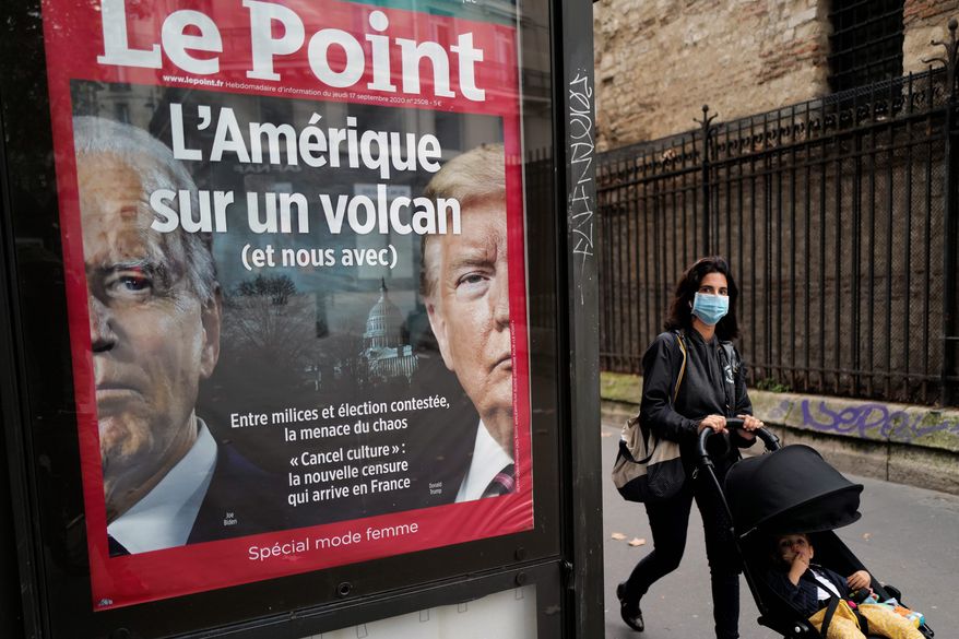 The front page of French weekly newspaper Le Point displays a photo of President Trump and Democratic presidential candidate Joseph R. Biden with a headline reading "America on a volcano, (and Us too)" in Paris. (ASSOCIATED PRESS)