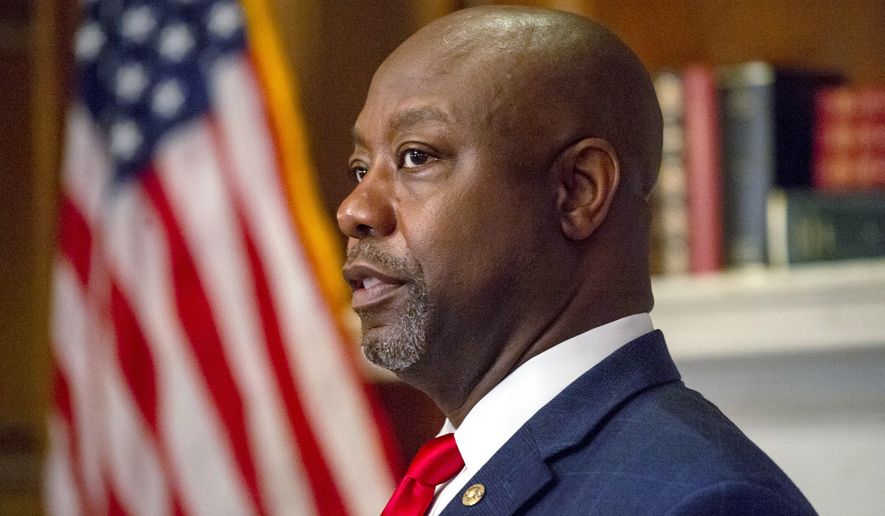 In this file photo, Sen. Tim Scott, R-S.C., meets with Judge Amy Coney Barrett, President Donald Trumps nominee for the U.S. Supreme Court, not shown, on Capitol Hill in Washington, Wednesday, Sept. 30, 2020. [Photo credit: Bonnie Cash] **FILE**