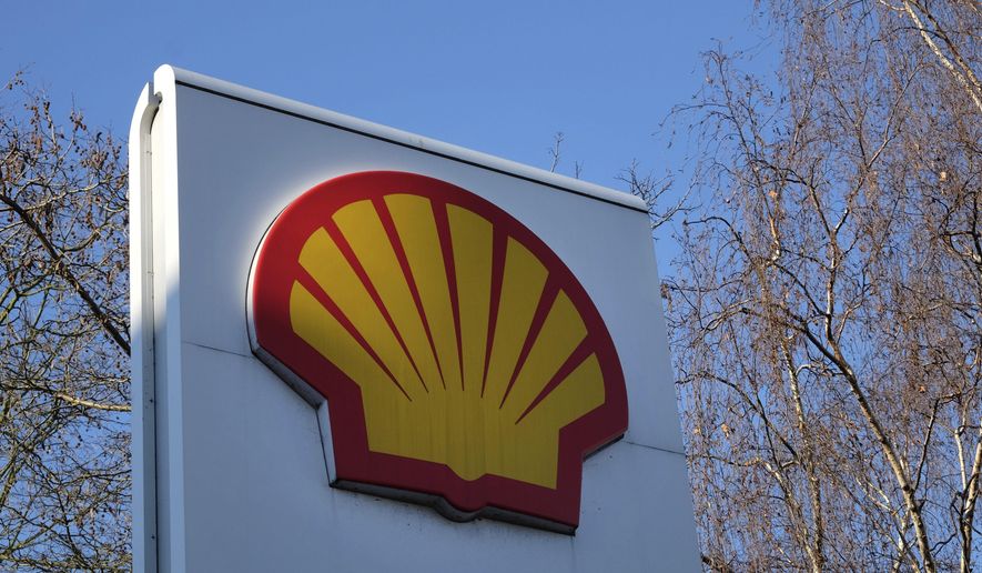 FILE - This Wednesday, Jan. 20, 2016 file photo, shows the Shell logo at a petrol station in London. Royal Dutch Shell said Wednesday Sept. 30, 2020, it is planning to cut between 7,000 and 9,000 jobs worldwide by the end of 2022 following a collapse in demand for oil and a subsequent slide in oil prices during the coronavirus pandemic. (AP Photo/Kirsty Wigglesworth, File)