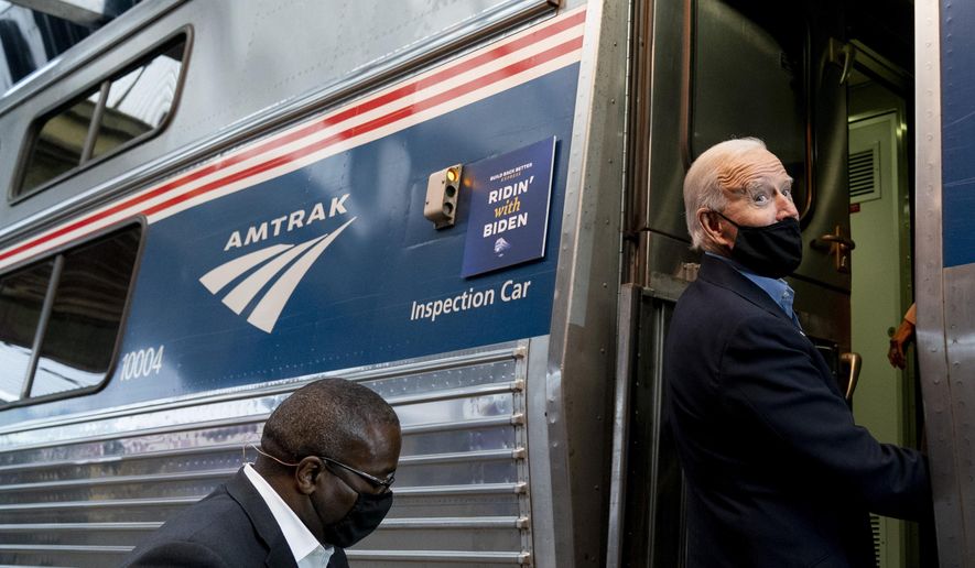 Democratic presidential candidate former Vice President Joe Biden boards his train at Amtrak&#39;s Pittsburgh Train Station, Wednesday, Sept. 30, 2020, in Pittsburgh. Biden is on a train tour through Ohio and Pennsylvania today. (AP Photo/Andrew Harnik)