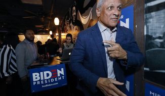 Mike Espy readies to speak with reporters in Jackson, Miss., after winning the Democratic nomination for a U.S. Senate seat in Mississippi, Tuesday, March 10, 2020. After his victory Tuesday, he will face Republican incumbent U.S. Sen. Cindy Hyde-Smith and Libertarian candidate Jimmy Edwards in November. (AP Photo/Rogelio V. Solis)