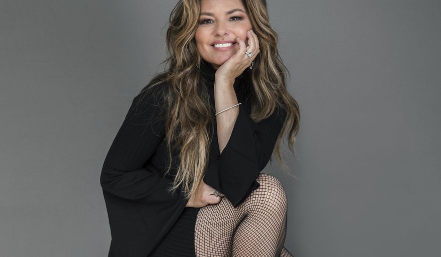 FILE - Shania Twain appears during a portrait session in New York on  June 14, 2019. Twain is celebrating the 25th anniversary of the album that turned her into a global superstar. She is releasing a deluxe reissue set of her 1995 breakthrough album “The Woman in Me,” which became the best-selling record by a woman in country music at the time. (Photo by Christopher Smith/Invision/AP, File)