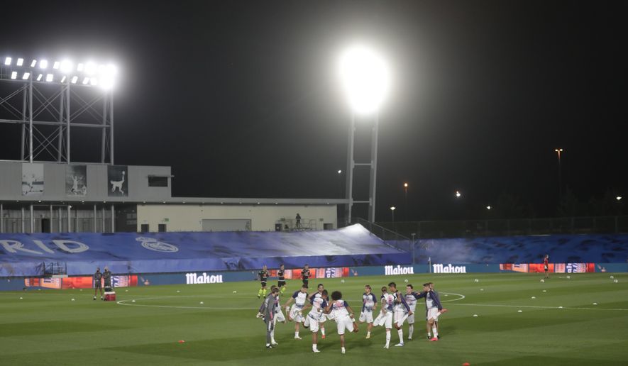 Real Madrid&#39;s players warm up prior to the Spanish La Liga soccer match between Real Madrid and Valladolid at Alfredo di Stefano stadium in Madrid, Spain, Wednesday, Sept. 30, 2020. (AP Photo/Manu Fernandez)