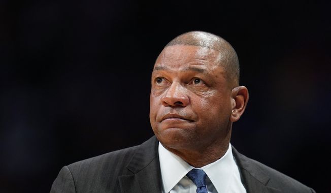  In this Jan. 12, 2020, file photo, Los Angeles Clippers coach Doc Rivers watches during the second quarter of the team&#x27;s NBA basketball game against the Denver Nuggets in Denver. The Philadelphia 76ers have reached an agreement with Rivers to become their new coach. Rivers reached a deal Thursday to become the latest coach to try to lead the Sixers to their first NBA championship since 1983, a person with direct knowledge of the negotiations told The Associated Press. The person spoke to the AP on Thursday on condition of anonymity because the Sixers had not formally announced the move. (AP Photo/Jack Dempsey, File)  **FILE**