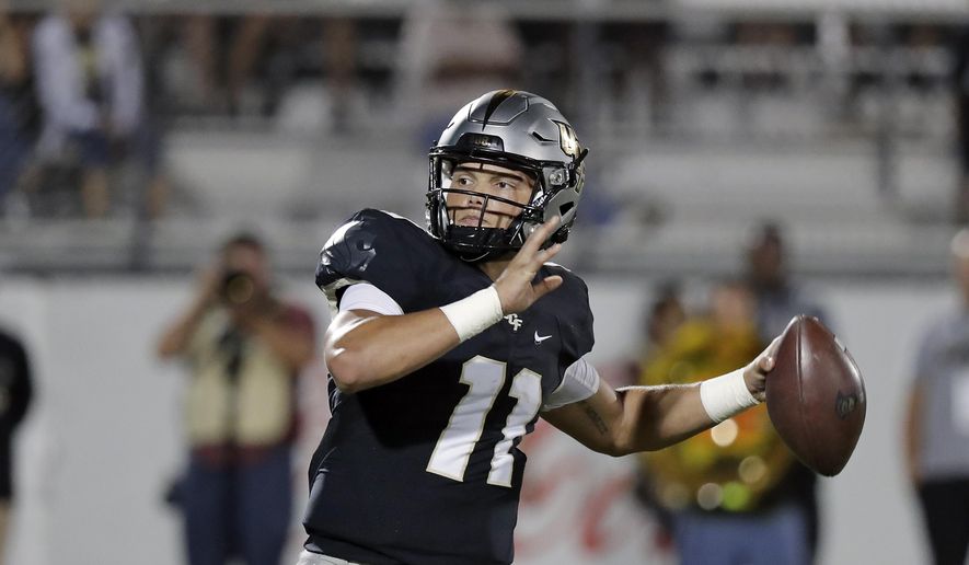 Central Florida quarterback Dillon Gabriel (11) looks for a receiver during the second half of an NCAA college football game against East Carolina, Saturday, Oct. 19, 2019, in Orlando, Fla. Gabriel and the 13th-ranked Knights open American Athletic Conference play on the road Saturday at East Carolina. (AP Photo/John Raoux)