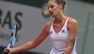 Karolina Pliskova of the Czech Republic reacts after losing a point against Egypt&#39;s Mayar Sherif in the first round match of the French Open tennis tournament at the Roland Garros stadium in Paris, France, Tuesday, Sept. 29, 2020. (AP Photo/Michel Euler)