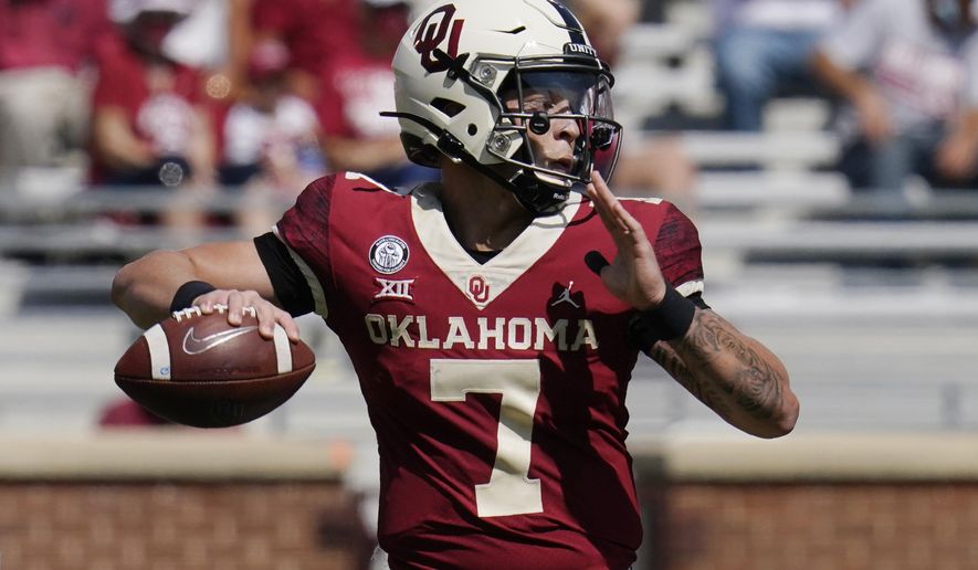 Oklahoma quarterback Spencer Rattler (7) passes in the second half of an NCAA college football game against Kansas State Saturday, Sept. 26, 2020, in Norman, Okla. (AP Photo/Sue Ogrocki).