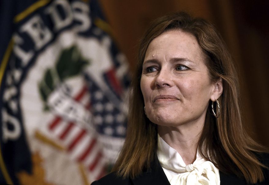 Judge Amy Coney Barrett, President Donald Trumps nominee for the U.S. Supreme Court, meets with Sen. Roger Wicker, R-Miss., not pictured, on Capitol Hill in Washington, Thursday, Oct. 1, 2020. (Olivier Douliery/Pool via AP)