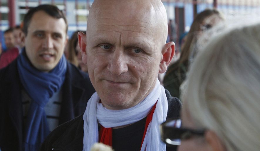 FILE - In this Saturday, June 21, 2014 file photo, Belarusian human rights advocate Ales Bialiatski is welcomed by his supporters at a railway terminal in Minsk, Belarus. The prominent Belarus opposition figure Ales Bialiatski and leading imprisoned Iranian human rights lawyer Nasrin Sotoudeh have been awarded the 2020 Swedish Right Livelihood Award, sometimes referred to as the “Alternative Nobel,” along with activists from Nicaragua and the United States. (AP Photo/Dmitry Brushko, File)