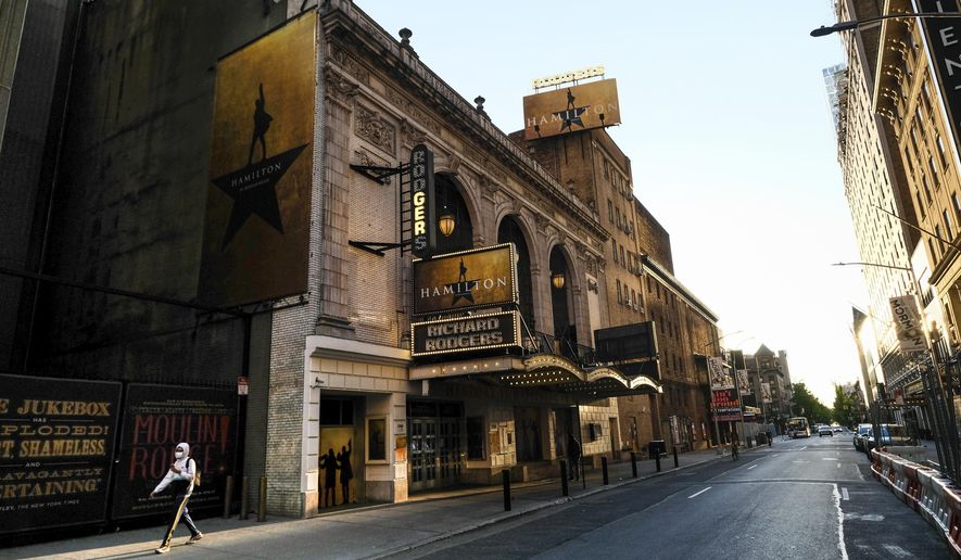 FILE - In this May 13, 2020, file photo, "Hamilton: An American Musical" at the Richard Rodgers Theatre is closed during Covid-19 lockdown, in New York. The U.S. labor union that represents more than 51,000 theater actors and stage managers is blasting a proposal that would raise eligibility requirements for members to receive health care. The Equity-League Pension Health Fund on Thursday, Oct. 1, 2020, proposed hiking the number of weeks of employment needed to qualify for six months of health care coverage from 11 weeks to 16 weeks. The proposal would start on Jan. 1, 2021. (Photo by Evan Agostini/Invision/AP, File)