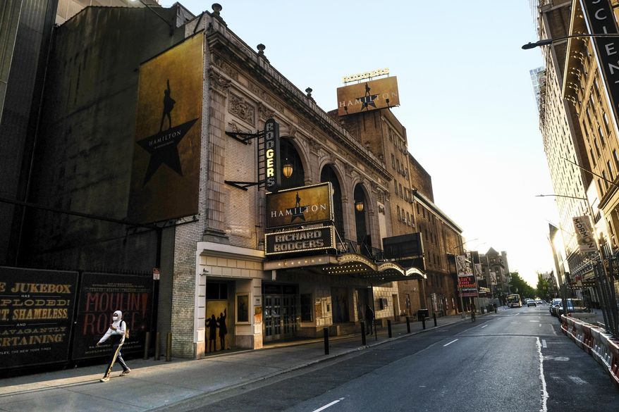 FILE - In this May 13, 2020, file photo, "Hamilton: An American Musical" at the Richard Rodgers Theatre is closed during Covid-19 lockdown, in New York. The U.S. labor union that represents more than 51,000 theater actors and stage managers is blasting a proposal that would raise eligibility requirements for members to receive health care. The Equity-League Pension Health Fund on Thursday, Oct. 1, 2020, proposed hiking the number of weeks of employment needed to qualify for six months of health care coverage from 11 weeks to 16 weeks. The proposal would start on Jan. 1, 2021. (Photo by Evan Agostini/Invision/AP, File)