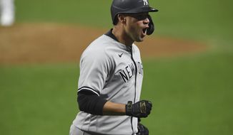 New York Yankees&#39; Gary Sanchez reacts after hitting a two-run home run off Cleveland Indians relief pitcher Triston McKenzie durng the sixth inning of Game 2 of an American League wild-card baseball series, Wednesday, Sept. 30, 2020, in Cleveland. (AP Photo/David Dermer)