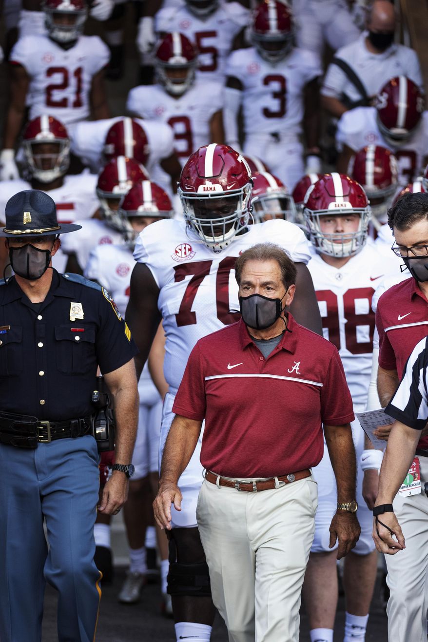 Alabama coach Nick Saban leads his team to the field before an NCAA college football game against Missouri on Saturday, Sept. 26, 2020, in Columbia, Mo. (AP Photo/L.G. Patterson)