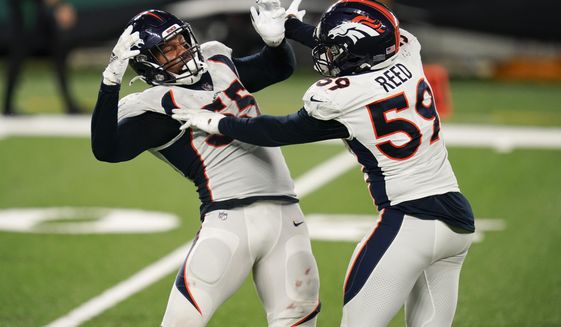 Denver Broncos&#39; Bradley Chubb (55) celebrates a sack with Malik Reed (59) during the second half of the team&#39;s NFL football game against the New York Jets on Thursday, Oct. 1, 2020, in East Rutherford, N.J. (AP Photo/Seth Wenig)