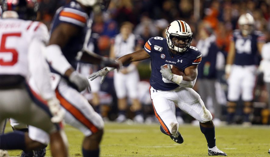 FILE - In this Nov. 2, 2019, file photo, Auburn running back Shaun Shivers (8) carries the ball during the first half of an NCAA college football game against Mississippi in Auburn, Ala. The Auburn Tigers once seemed virtual locks to have at least one 1,000-yard rusher every season. (AP Photo/Butch Dill, File)