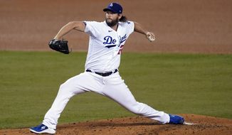 Los Angeles Dodgers starting pitcher Clayton Kershaw throws to a Milwaukee Brewers batter during the third inning in Game 2 of a National League wild-card baseball series Thursday, Oct. 1, 2020, in Los Angeles. (AP Photo/Ashley Landis)