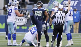 Seattle Seahawks defensive end Alton Robinson (98) celebrates a play during the second half of an NFL football game against the Dallas Cowboys, Sunday, Sept. 27, 2020, in Seattle. The Seahawks won 38-31. (AP Photo/John Froschauer)