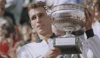 FILE - In this June 9, 1986, file image top-seed Ivan Lendl holds his trophy in Paris after winning the French Open tennis tournament with his victory over Sweden&#39;s Mikael Pernfors. Lendl beat Pernfors 6-3, 6-2, 6-4. Lendl was on the receiving end of the most famous underarm serve in tennis history, when a cramping Michael Chang used one to win a point in the fifth set of their fourth-round match at Roland Garros in 1989. Underarm serves are being used by some players at this year&#39;s French Open and there is some discussion about whether they are a legitimate tactic. Lendl tells the AP they&#39;re &amp;quot;perfectly fine.&amp;quot; (AP Photo/Pierre Gleizes, File)