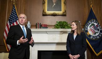 Sen. Thom Tillis, R-N.C., meets with Judge Amy Coney Barrett, President Donald Trump&#39;s nominee to the Supreme Court at the U.S. Capitol Wednesday, Sept. 30, 2020, in Washington. (Bill Clark/Pool via AP)
