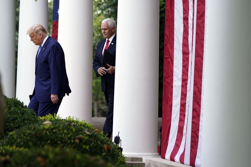 President Donald Trump arrives with Vice President Mike Pence to speak about coronavirus testing during an event in the Rose Garden of the White House, Monday, Sept. 28, 2020, in Washington. (AP Photo/Evan Vucci) **FILE**