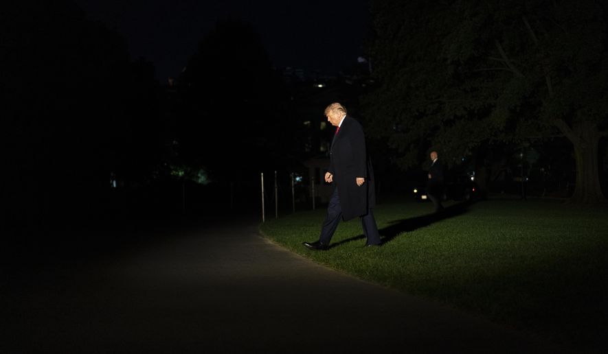 FILE - In this Thursday, Oct. 1, 2020, file photo President Donald Trump walks from Marine One to the White House in Washington as he returns from Minnesota. The Republican president has trailed Democratic challenger Joe Biden in polls for most of the year. Trump’s approval ratings barely budge, consistently ranking him as among the weakest first-term presidents in living history. And for five consecutive months, no more than roughly 3 in 10 voters have believed the nation is moving in the right direction. (AP Photo/Carolyn Kaster, File)