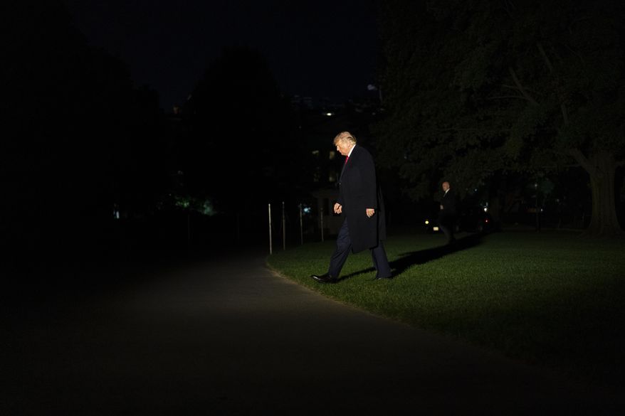 FILE - In this Thursday, Oct. 1, 2020, file photo President Donald Trump walks from Marine One to the White House in Washington as he returns from Minnesota. The Republican president has trailed Democratic challenger Joe Biden in polls for most of the year. Trump’s approval ratings barely budge, consistently ranking him as among the weakest first-term presidents in living history. And for five consecutive months, no more than roughly 3 in 10 voters have believed the nation is moving in the right direction. (AP Photo/Carolyn Kaster, File)