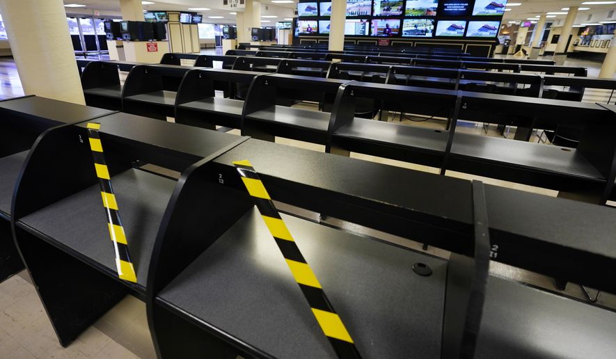 Betting tables are empty at Pimlico race track, Friday, Oct. 2, 2020, in Baltimore, Md., ahead Saturday's Black-Eyed Susan and Preakness Stakes races. (AP Photo/Steve Helber)