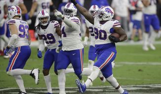 Buffalo Bills defensive tackle Quinton Jefferson (90) celebrates after recovering a fumble by the Las Vegas Raiders during the second half of an NFL football game, Sunday, Oct. 4, 2020, in Las Vegas. (AP Photo/Isaac Brekken)