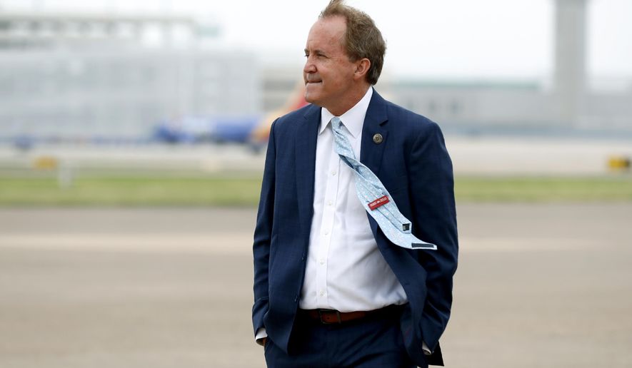 FILE - State Attorney General Ken Paxton waits on the flight line for the arrival of Vice President Mike Pence at Love Field in Dallas, Sunday, June 28, 2020. Several top deputies of Texas’ attorney general have accused him of crimes including bribery and abuse of office in an internal letter saying they’ve reported the actions to law enforcement. In a brief letter, seven senior lawyers wrote that they reported Paxton for potentially breaking the law “in his official capacity as the current Attorney General of Texas.&amp;quot; Paxton’s defense attorney in the securities case, declined to comment on the new allegations Sunday, Oct. 4, 2020. Paxton pleaded not guilty in that case but it is not clear whether the new accusations are related. (AP Photo/Tony Gutierrez)