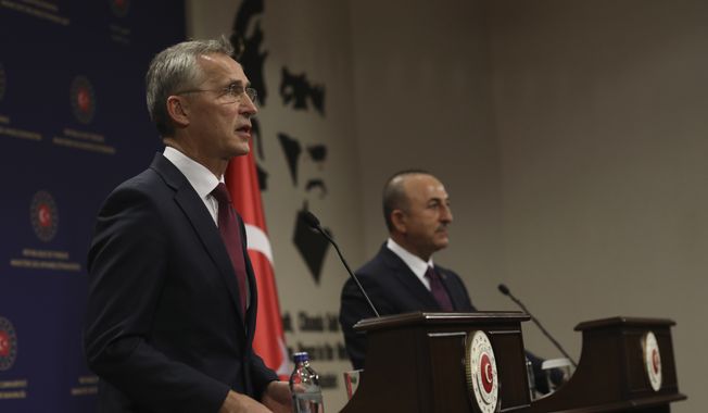 NATO Secretary-General Jens Stoltenberg, left, and Turkey&#x27;s Foreign Minister Mevlut Cavusoglu speak to the media after their talks in Ankara, Turkey, Monday, Oct. 5, 2020. Stoltenberg said the 30-country military alliance is &quot;deeply concerned by the escalation of hostilities &quot; between Azerbaijan and Armenia and he urged Turkey to help end the fighting. (AP Photo/Burhan Ozbilici)