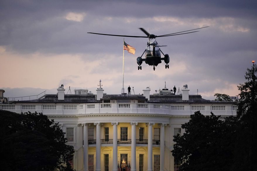 President Donald Trump arrives back at the White House aboard Marine One, Monday evening, Oct. 5, 2020 in Washington, after being treated for COVID-19 at Walter Reed National Military Medical Center. The president&#x27;s personal physician, Dr. Sean Conley, told reporters on Monday afternoon that Trump is not out of the woods yet, but that there is no care at the hospital that the president cannot get at the White House. (AP Photo/J. Scott Applewhite)