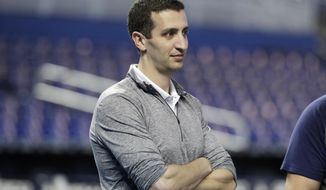 File-Milwaukee Brewers general manager David Stearns stands on the field before a baseball game against the Miami Marlins, Wednesday, Sept. 11, 2019, in Miami.  Stearns says this year’s abbreviated schedule makes it difficult to evaluate his roster as he tries to make offseason improvements. (AP Photo/Lynne Sladky, File)