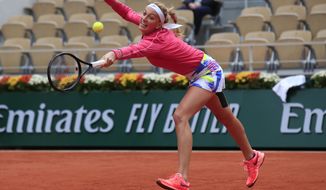 Petra Kvitova of the Czech Republic plays a shot against China&#39;s Zhang Shuai in the fourth round match of the French Open tennis tournament at the Roland Garros stadium in Paris, France, Monday, Oct. 5, 2020. (AP Photo/Michel Euler)