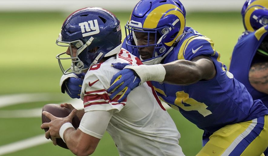 New York Giants quarterback Daniel Jones, left, is tackled by Los Angeles Rams outside linebacker Leonard Floyd during the second half of an NFL football game Sunday, Oct. 4, 2020, in Inglewood, Calif. (AP Photo/Jae C. Hong)