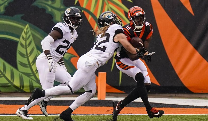 Jacksonville Jaguars free safety Andrew Wingard (42) breaks up a pass to Cincinnati Bengals wide receiver A.J. Green (18) in the second half of an NFL football game in Cincinnati, Sunday, Oct. 4, 2020. (AP Photo/Bryan Woolston)