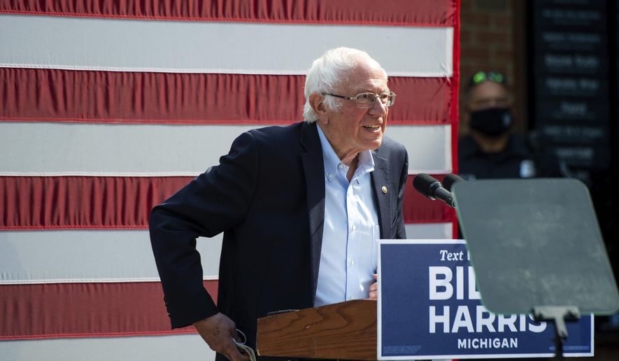 In this file photo, Vermont Sen. Bernie Sanders approaches the stage at Kerrytown Market in Ann Arbor on Monday, Oct. 5, 2020. (Jacob Hamilton/Ann Arbor News via AP)  ** FILE **