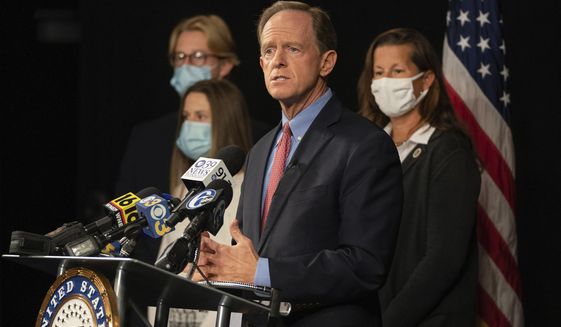 Republican U.S. Sen. Pat Toomey, of Pennsylvania, announces he won&#39;t seek reelection or run for governor during a news conference with his family, Monday, Oct. 5, 2020 at PPL Public Media Center, in Bethlehem, Pa. (Jessica Griffin/The Philadelphia Inquirer via AP)