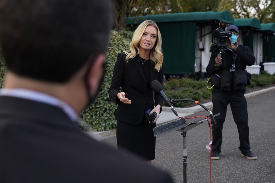 White House press secretary Kayleigh McEnany, talks to the media, Sunday, Oct. 4, 2020, outside the White House in Washington. (AP Photo/Jacquelyn Martin))