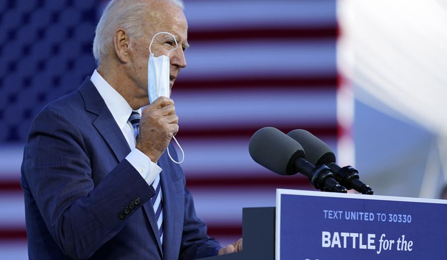 Democratic presidential candidate former Vice President Joe Biden talks about wearing a face mask as he speaks at Gettysburg National Military Park in Gettysburg, Pa., Tuesday, Oct. 6, 2020. (AP Photo/Andrew Harnik)