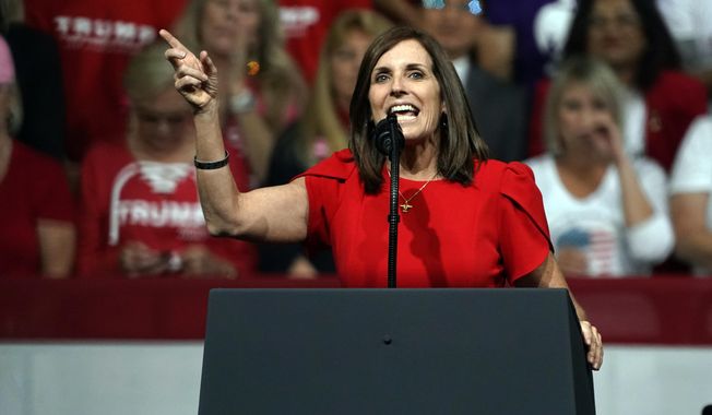 FILE - In this Feb. 19, 2020, file photo, Sen. Martha McSally, R-Ariz., speaks at a rally for President Donald Trump in Phoenix. McSally and Democratic challenger Mark Kelly meet Tuesday, Oct. 6, 2020, in what’s likely to be the only debate of the campaign. (AP Photo/Rick Scuteri, File)