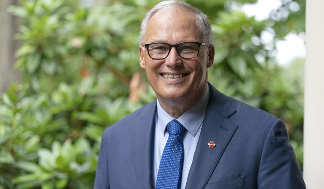 Washington Gov. Jay Inslee poses for a photo, Friday, Sept. 25, 2020, in Olympia, Wash. Inslee, a Democrat, is being challenged by Republican Loren Culp, police chief of the small town of Republic, Wash., in the Nov. 3 election. (AP Photo/Ted S. Warren)