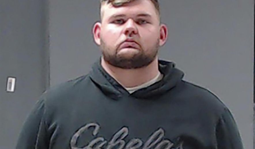 This booking photo provided by the Hunt County (Texas) Sheriff's Office shows Wolfe City Police Officer Shaun Lucas on Monday, Oct. 5, 2020. Lucas has been charged with murder in the fatal shooting of a Black man following a reported disturbance at a convenience store in a small East Texas town over the weekend, authorities said. (Hunt County Sheriff's Office via AP)