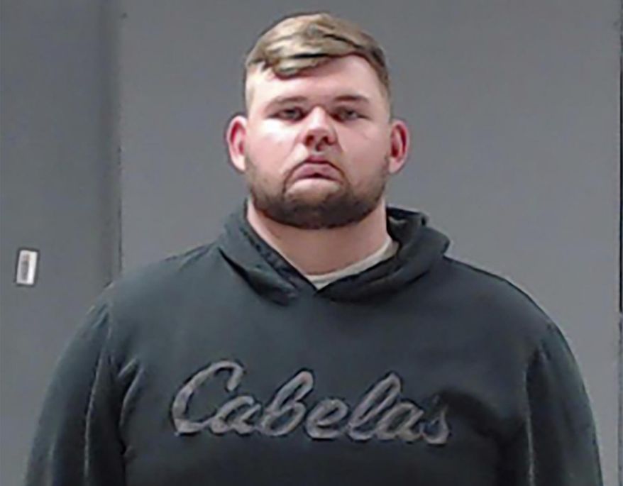 This booking photo provided by the Hunt County (Texas) Sheriff's Office shows Wolfe City Police Officer Shaun Lucas on Monday, Oct. 5, 2020. Lucas has been charged with murder in the fatal shooting of a Black man following a reported disturbance at a convenience store in a small East Texas town over the weekend, authorities said. (Hunt County Sheriff's Office via AP)