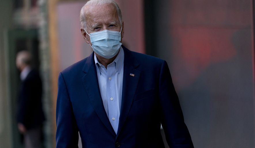 Democratic presidential candidate former Vice President Joe Biden speaks to members of the media as he leaves the Queen Theater in Wilmington, Del., Wednesday, Oct. 7, 2020. (AP Photo/Andrew Harnik)